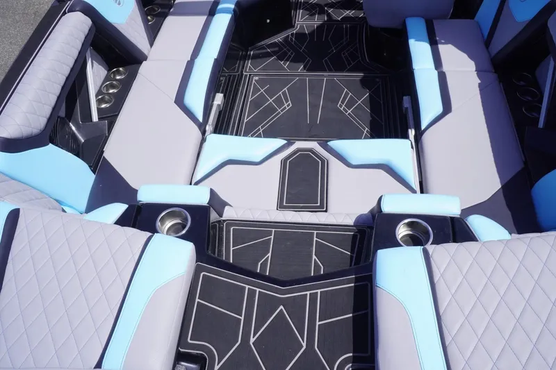 Slide: The Image of 2023 Tigé 23ZX boat interior with modern seating and cup holders. - 34