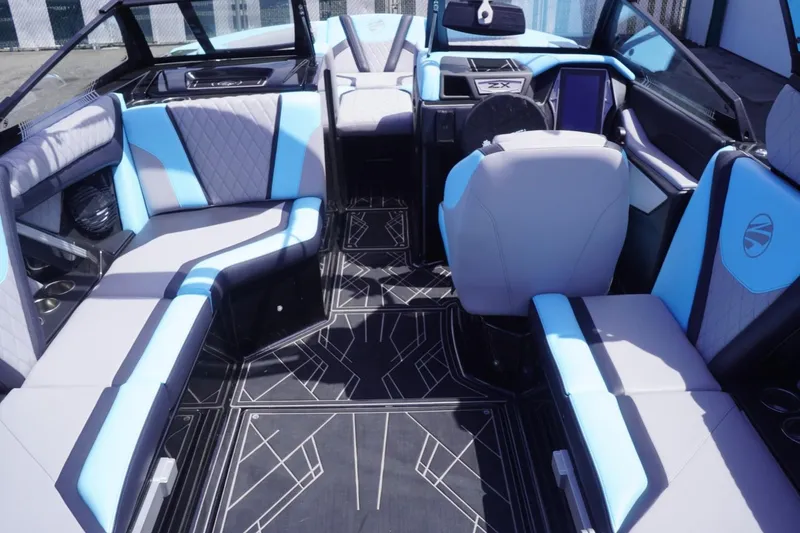 Slide: The Image of 2023 Tigé 23ZX boat interior with modern seating and sleek design. - 39