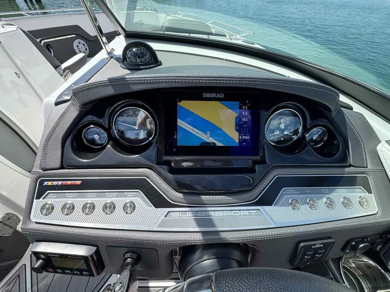 Slide: The Image of Dashboard of 2023 Monterey 275SS boat with navigation system and controls. - 12