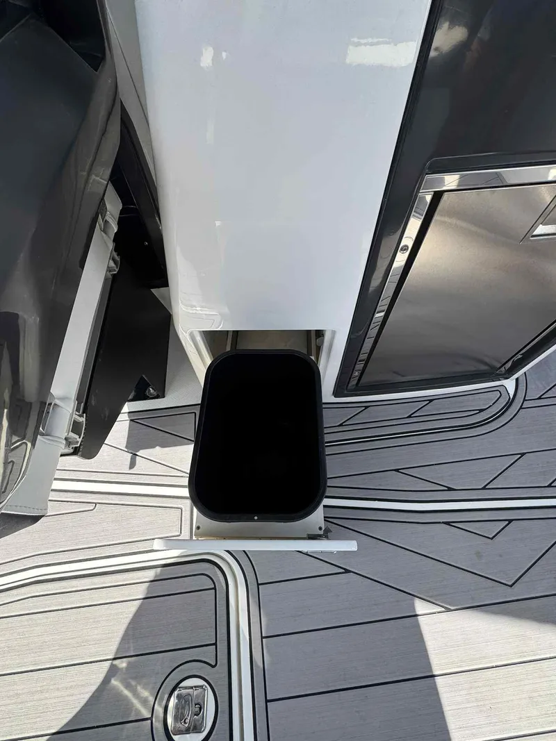Slide: The Image of 2023 Monterey 275SS boat deck with integrated storage compartment. - 17