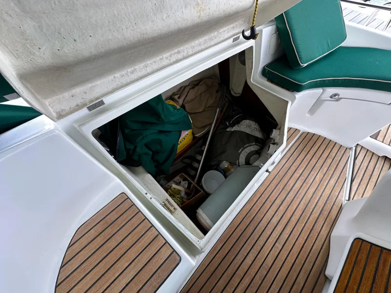Slide: The Image of Storage compartment on 2002 Beneteau 411 sailboat with teak deck and green seating. - 22