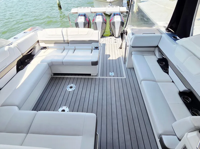 Slide: The Image of 2021 Formula 380 Super Sport Crossover OB boat interior with spacious seating and modern design. - 10