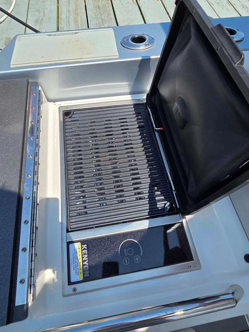 Slide: The Image of Built-in Kenyon grill on 2021 Formula 380 Super Sport Crossover OB boat deck. - 23