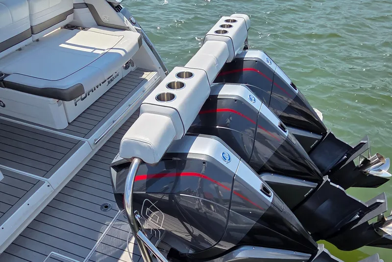 Slide: The Image of 2021 Formula 380 Super Sport Crossover OB with triple outboard engines on water. - 28