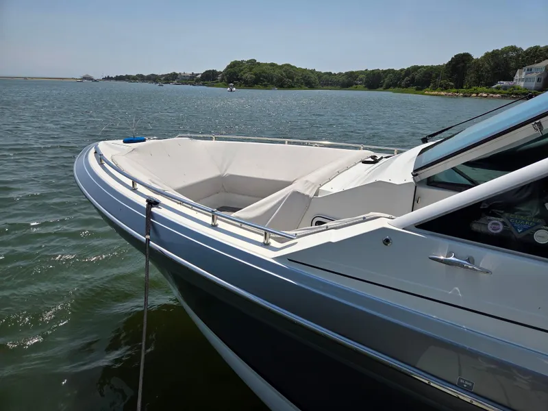 Slide: The Image of 2021 Formula 380 Super Sport Crossover OB on calm water, scenic background. - 3