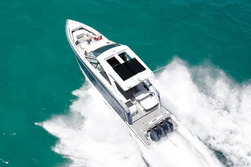 Slide: The Image of Manufacturer Provided Image: 2021 Formula 380 Super Sport Crossover OB cruising on clear blue water. - 4