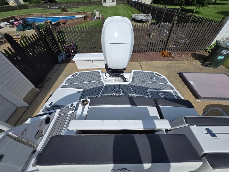 Slide: The Image of 2021 Monterey M-65 boat with sleek deck design and powerful outboard motor. - 11