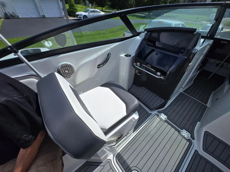 Slide: The Image of Interior of a 2021 Monterey M-65 boat with modern seating and dashboard. - 13