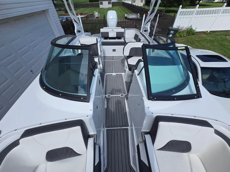 Slide: The Image of 2021 Monterey M-65 boat with sleek design, spacious seating, and modern features. - 21