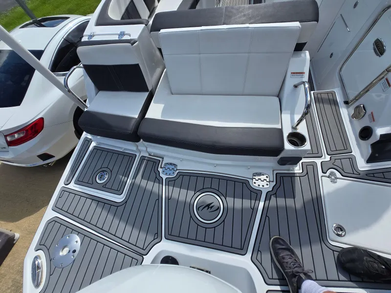 Slide: The Image of 2021 Monterey M-65 boat interior with sleek seating and modern design elements. - 24