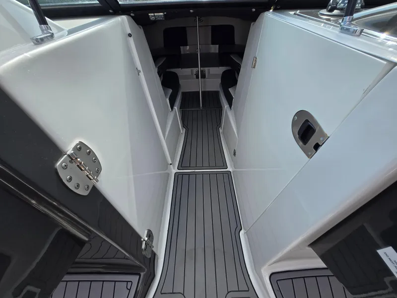 Slide: The Image of 2021 Monterey M-65 boat interior with sleek, modern design and gray flooring. - 30