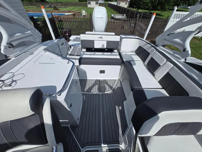 Slide: The Image of 2021 Monterey M-65 boat interior with sleek seating and modern design. - 4