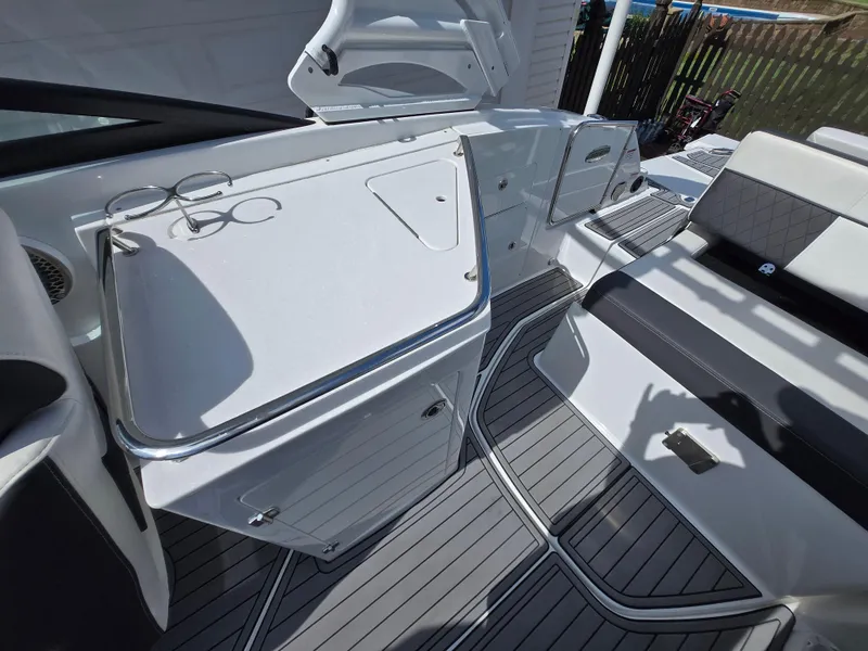 Slide: The Image of 2021 Monterey M-65 boat interior with sleek seating and modern design. - 8