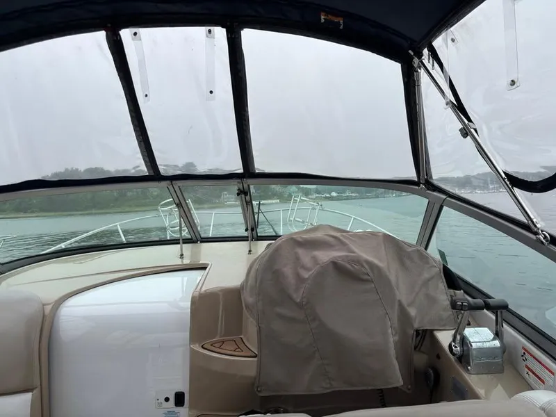 Slide: The Image of Interior view of 2009 Four Winns 288 Vista boat cockpit with covered controls. - 3
