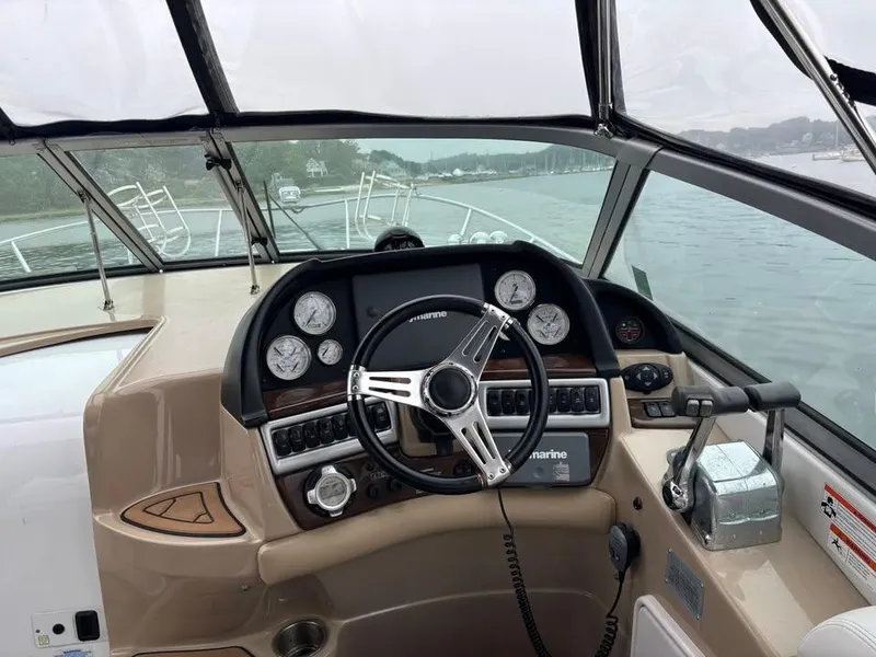 Slide: The Image of 2009 Four Winns 288 Vista boat helm with steering wheel and control panel. - 4