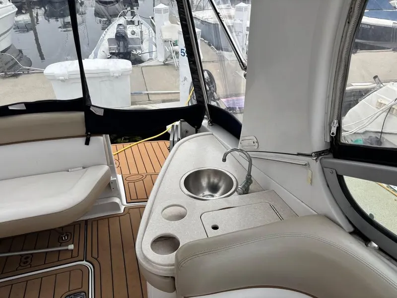 Slide: The Image of 2009 Four Winns 288 Vista boat interior with sink and seating area. - 5