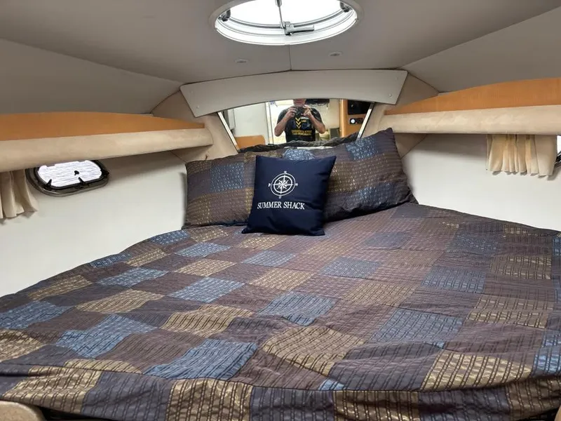Slide: The Image of Interior cabin of 2009 Four Winns 288 Vista boat with cozy bedding. - 7