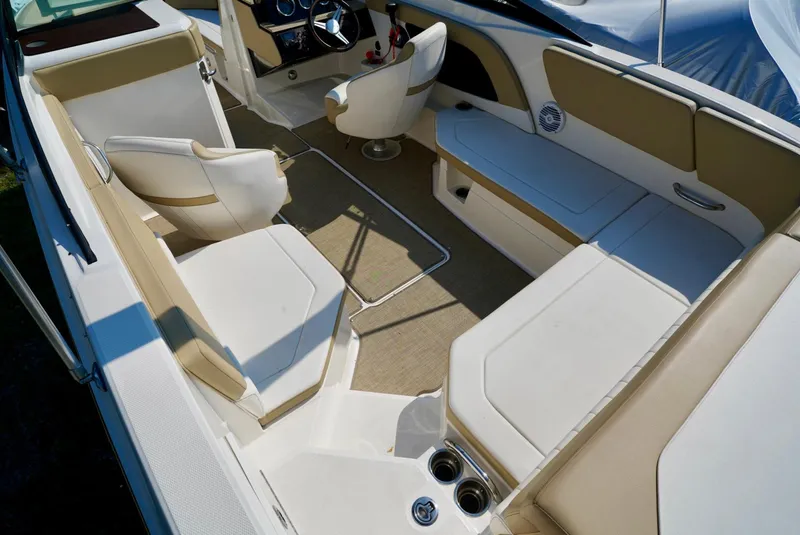 Slide: The Image of Interior of 2018 Sea Ray SPX 230 boat with beige and white seating. - 11