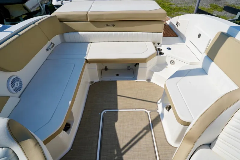 Slide: The Image of 2018 Sea Ray SPX 230 boat interior with beige and white seating. - 12