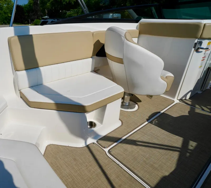 Slide: The Image of 2018 Sea Ray SPX 230 boat interior with beige and white seating. - 14