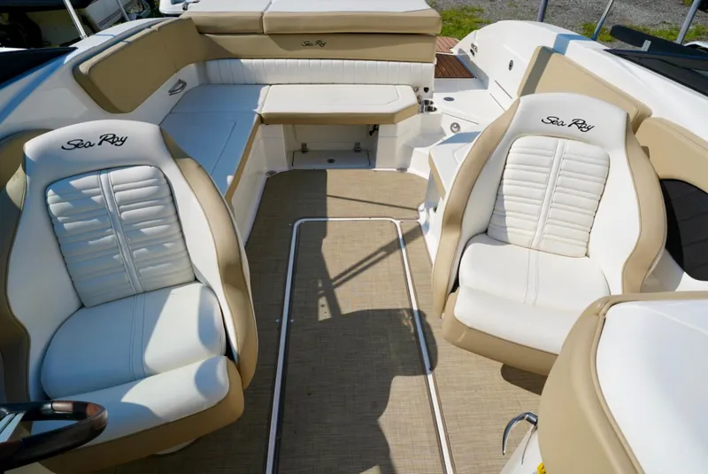 Slide: The Image of 2018 Sea Ray SPX 230 boat interior with beige and white seating. - 20