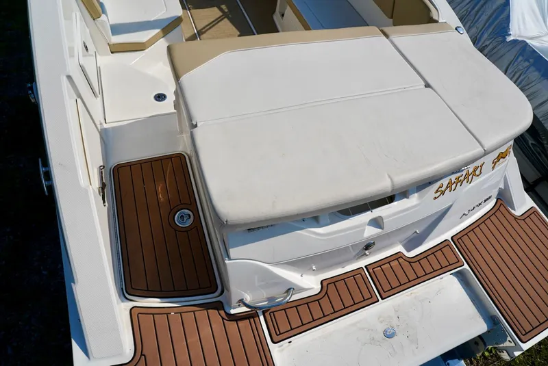 Slide: The Image of 2018 Sea Ray SPX 230 boat with teak-style decking and cushioned seating. - 8