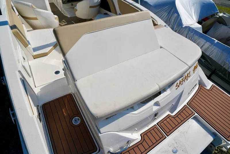 Slide: The Image of 2018 Sea Ray SPX 230 boat with beige seating and teak-style flooring. - 9