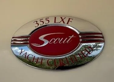 Slide: The Image of 2018 Scout 355 LXF boat deck with covered engines and storage compartments. - 24