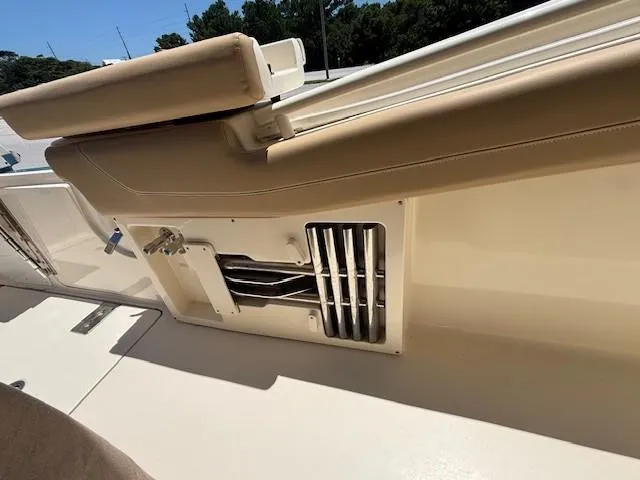 Slide: The Image of 2018 Scout 355 LXF boat dashboard with navigation screens and controls. - 32