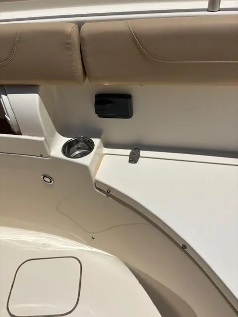 Slide: The Image of 2018 Scout 355 LXF boat deck with compass design and seating area. - 44