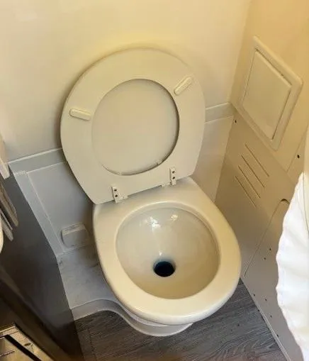 Slide: The Image of 2018 Scout 355 LXF boat interior with sink and faucet. - 53