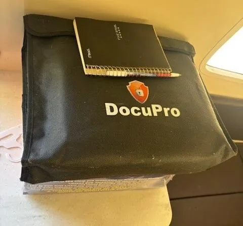 Slide: The Image of DocuPro bag with notebook and pen on a surface, Scout 355 LXF, 2018 model. - 58