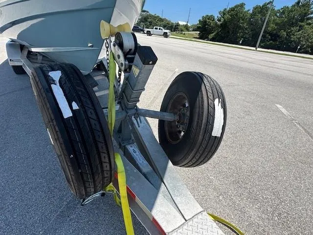 Slide: The Image of 2018 Scout 355 LXF yacht certified emblem with red and silver design. - 8