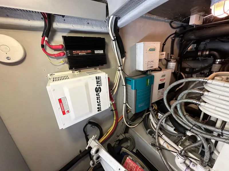 Slide: The Image of Engine room of 2004 Meridian 580 Pilothouse with electrical components and wiring. - 36