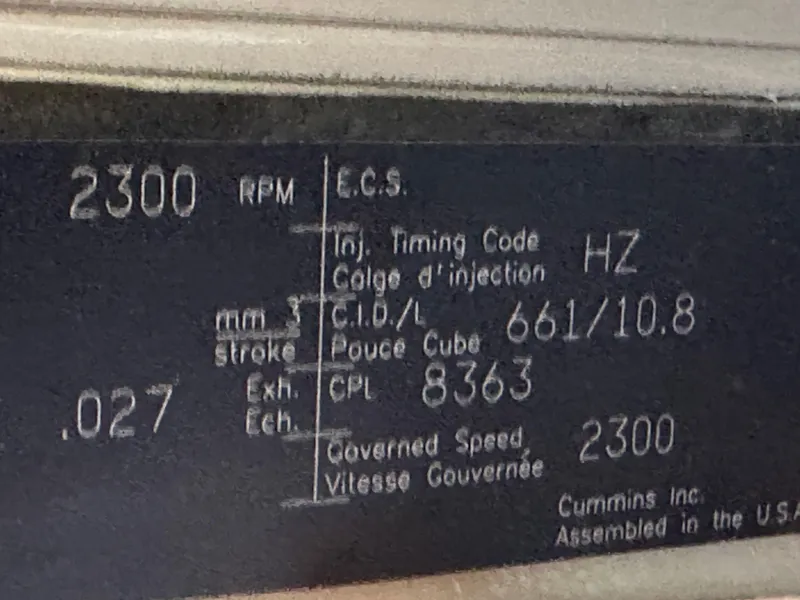 Slide: The Image of Engine specification plate for a 2004 Meridian 580 Pilothouse, showing RPM and other technical details. - 42