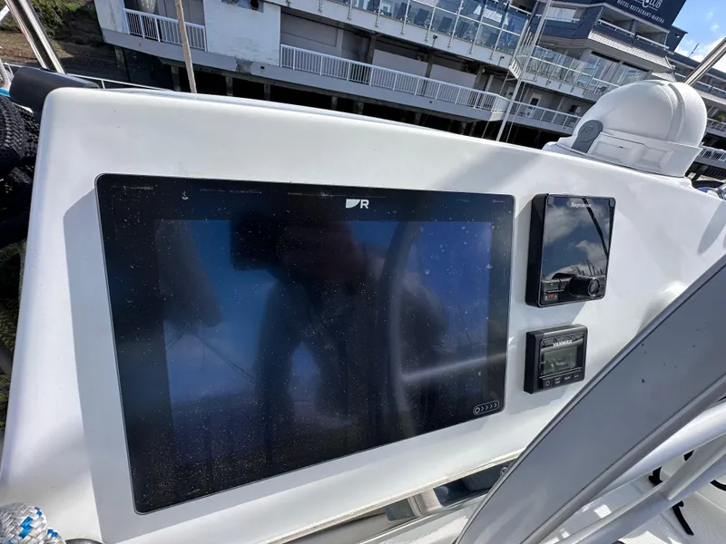 Slide: The Image of Control panel of 2023 Bali 4.2 yacht with navigation screens and instruments. - 13
