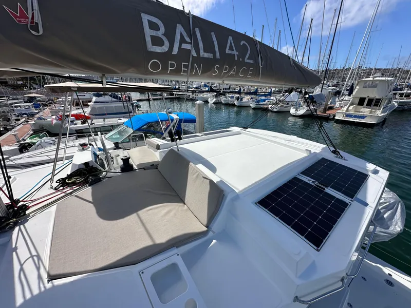 Slide: The Image of 2023 Bali 4.2 catamaran with solar panels docked in marina. - 17