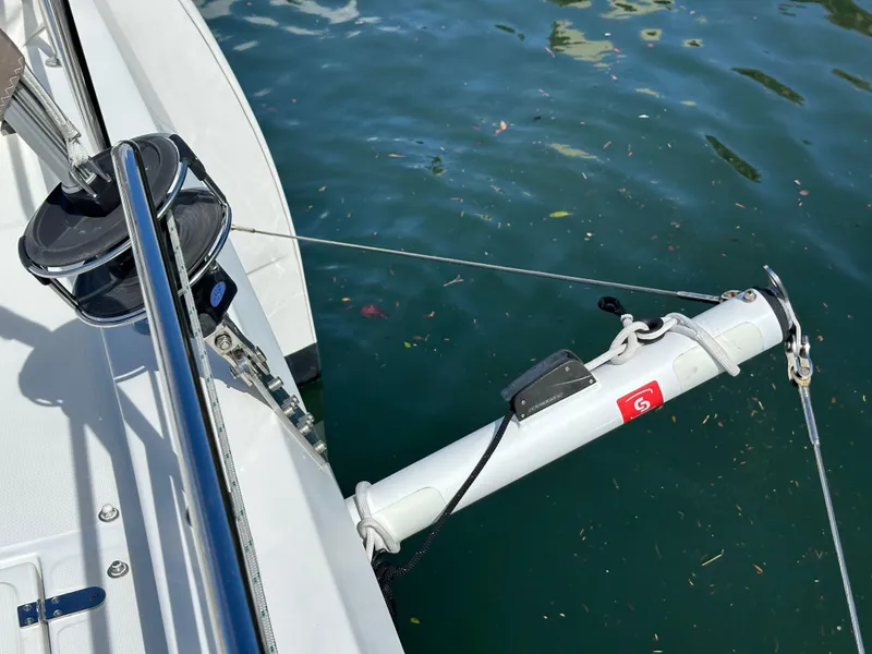 Slide: The Image of Sailboat rigging on a 2023 Bali 4.2, floating on calm water. - 24