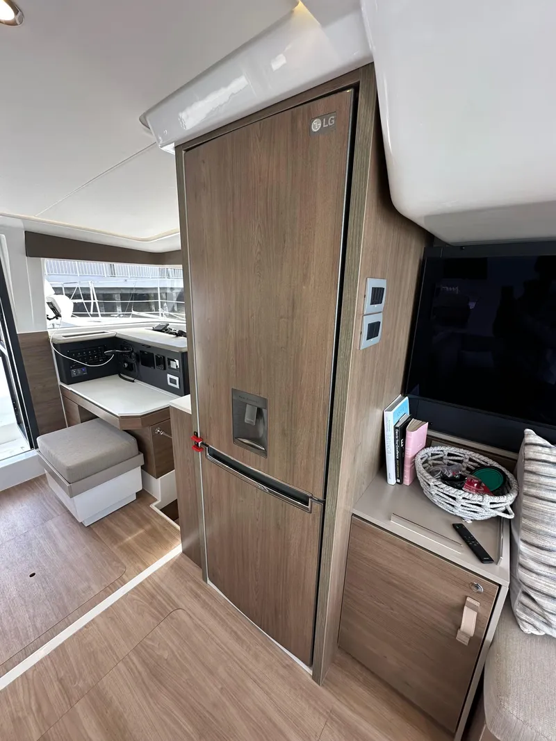 Slide: The Image of Interior of a 2023 Bali 4.2 yacht featuring modern kitchen and seating area. - 42
