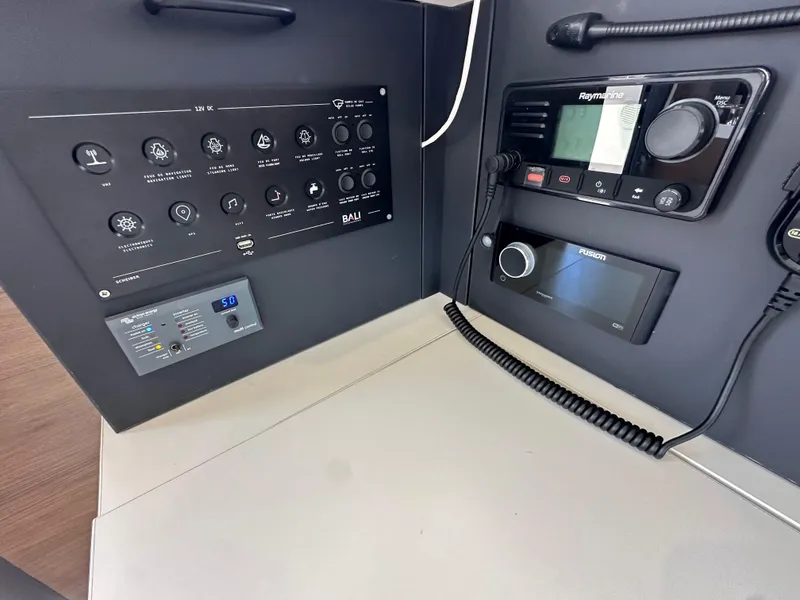 Slide: The Image of Control panel of a 2023 Bali 4.2 yacht with navigation and communication equipment. - 47