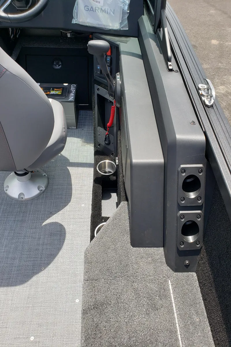 Slide: The Image of 2025 Alumacraft Competitor 185X Sport interior with steering wheel, seat, and control panel. - 14