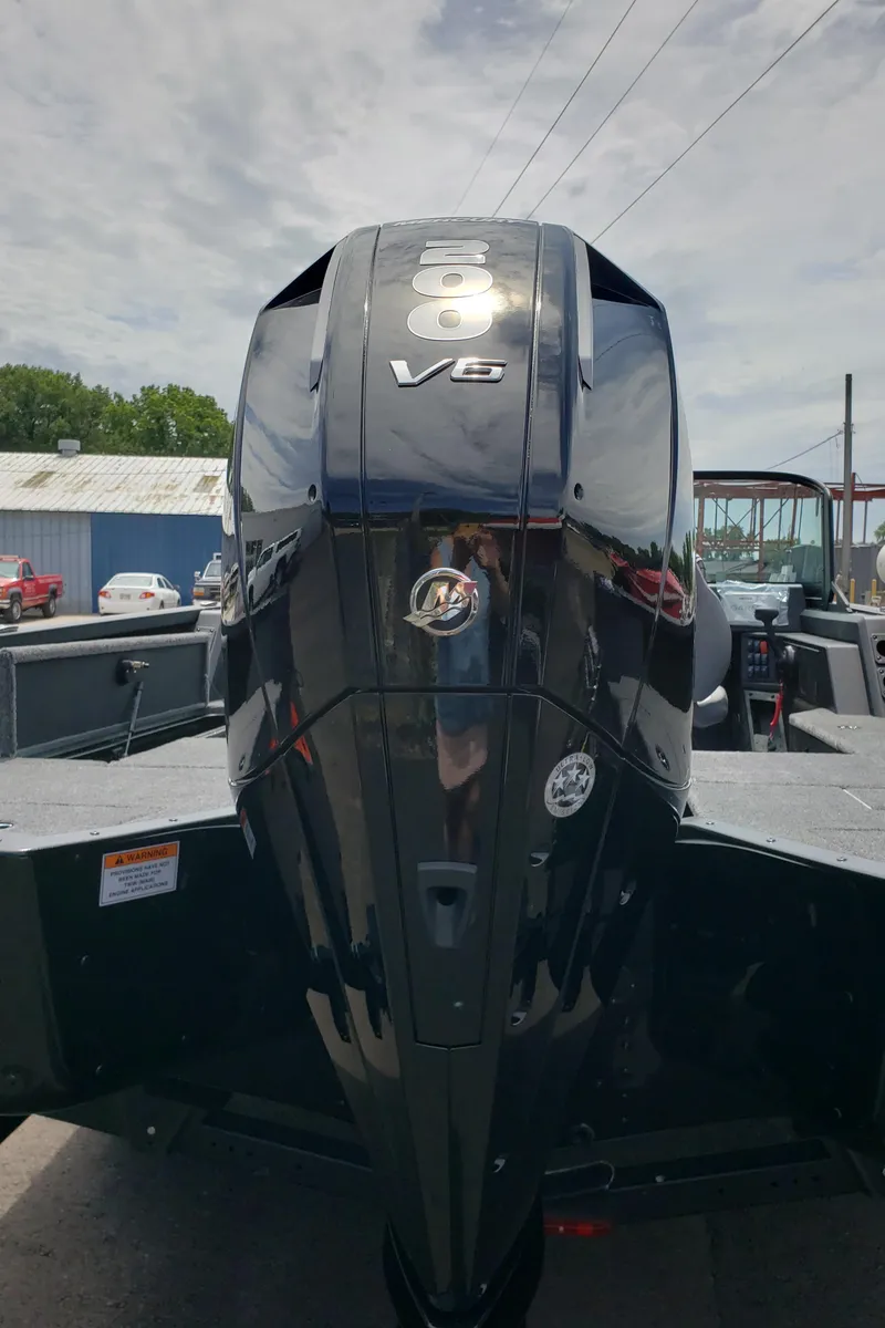 Slide: The Image of 2025 Alumacraft Competitor 185X Sport with powerful V8 engine, rear view. - 4