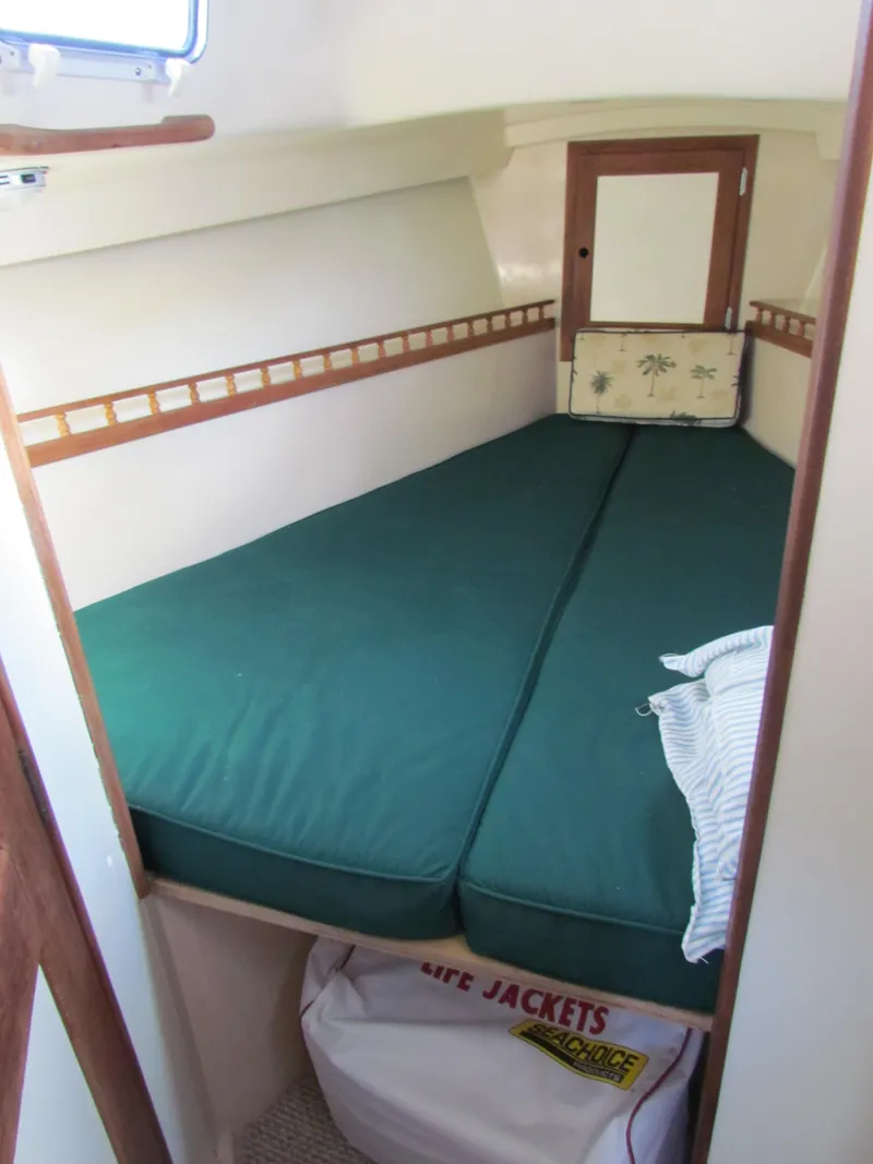 Slide: The Image of Interior of a 1972 Morgan 35 sailboat with kitchenette and seating area. - 12