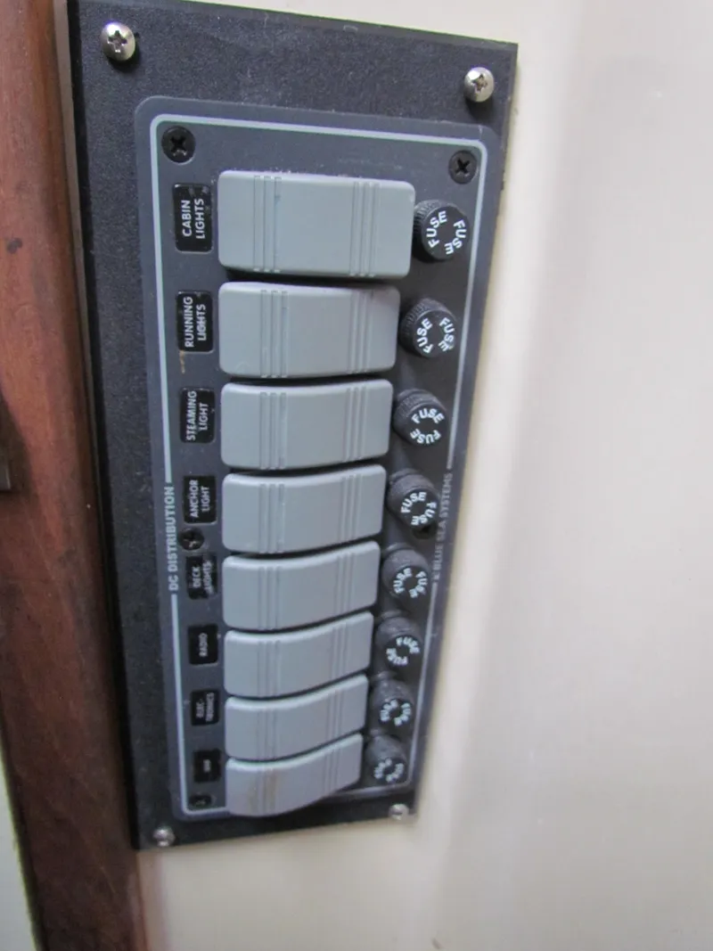 Slide: The Image of 1972 Morgan 35 boat bathroom with toilet, sink, mirror, and window. - 32