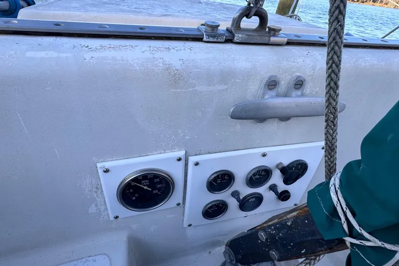 Slide: The Image of 1972 Morgan 35 sailboat cockpit with gauges and controls. - 40