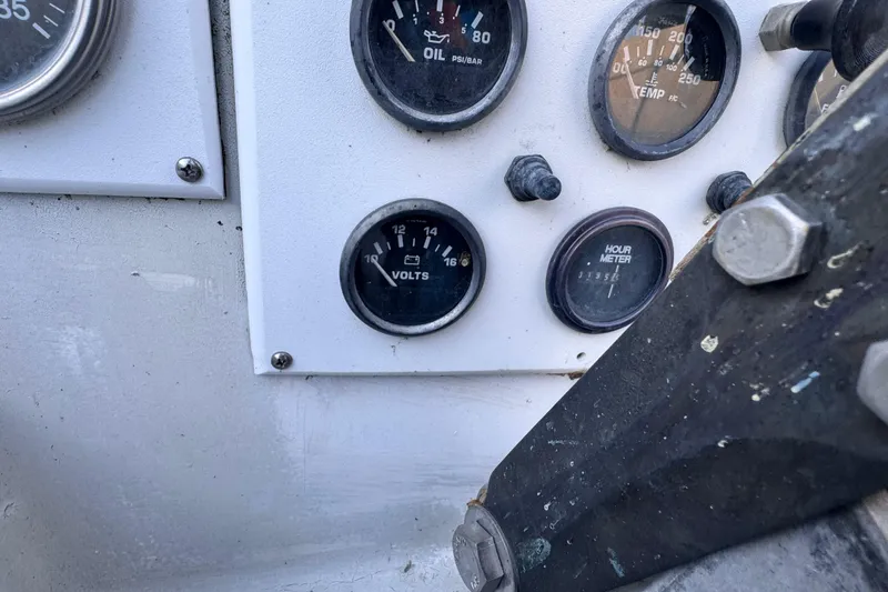 Slide: The Image of 1972 Morgan 35 dashboard with oil, temperature, volts, and hour meter gauges. - 41