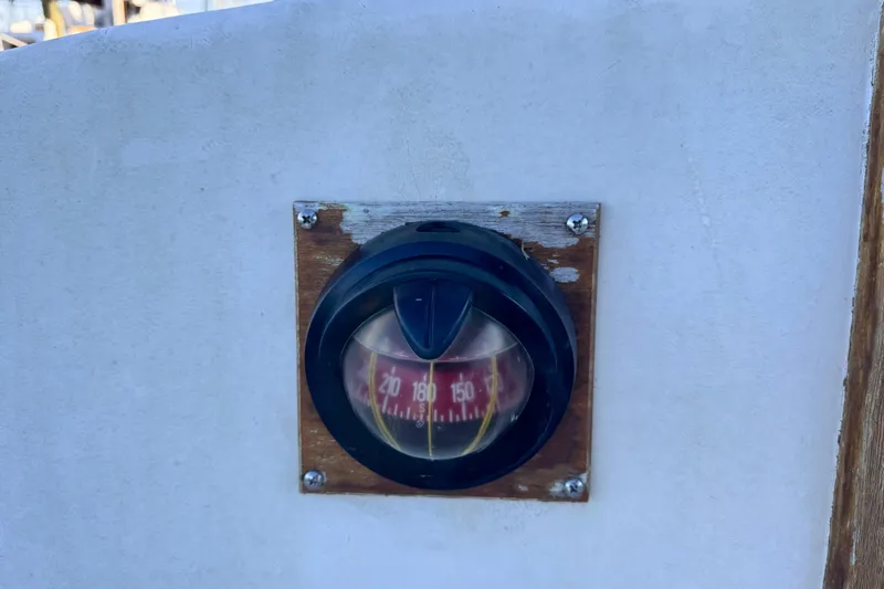 Slide: The Image of Vintage compass on 1972 Morgan 35 sailboat, mounted on wooden panel. - 44