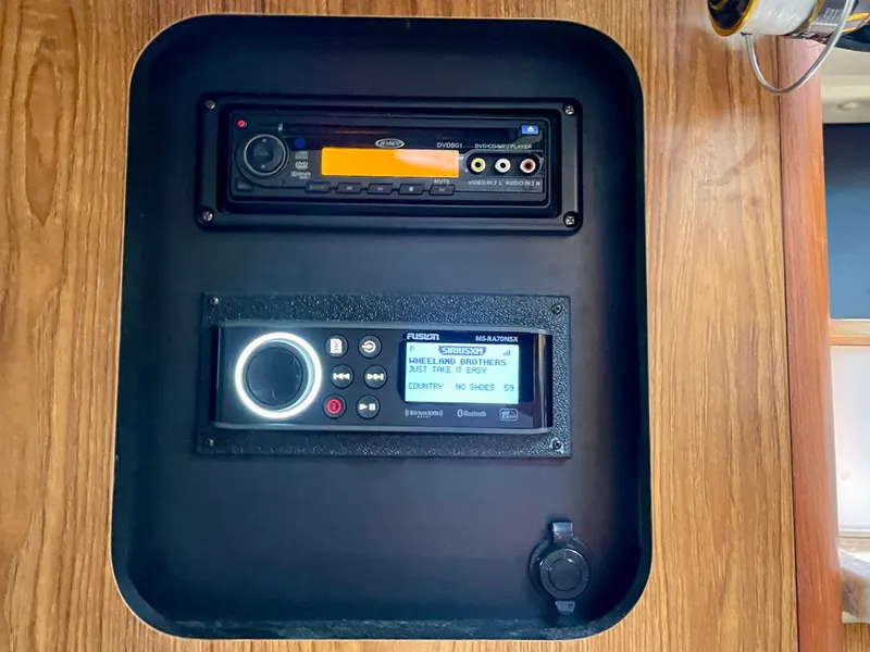 Slide: The Image of Audio system panel on a 2011 Pursuit 315 Offshore boat, featuring SiriusXM display. - 40