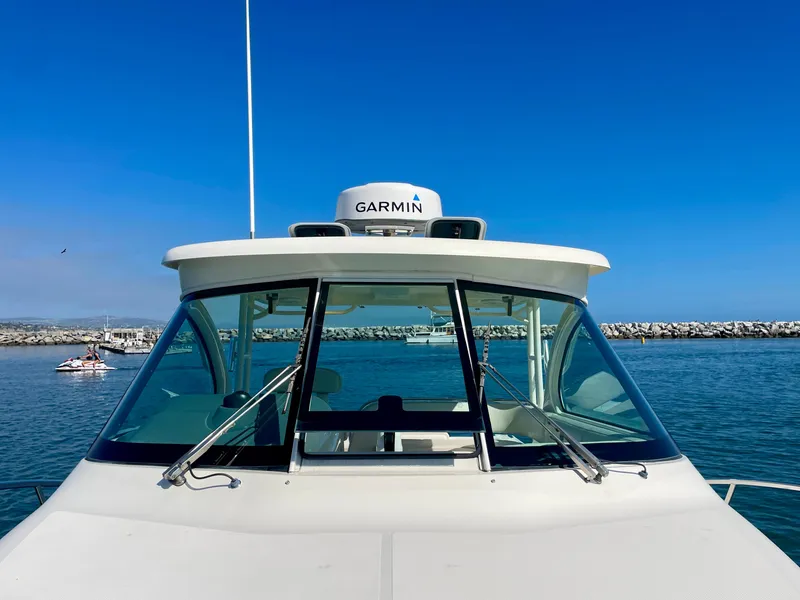Slide: The Image of 2011 Pursuit 315 Offshore boat with Garmin equipment on a sunny day at sea. - 47
