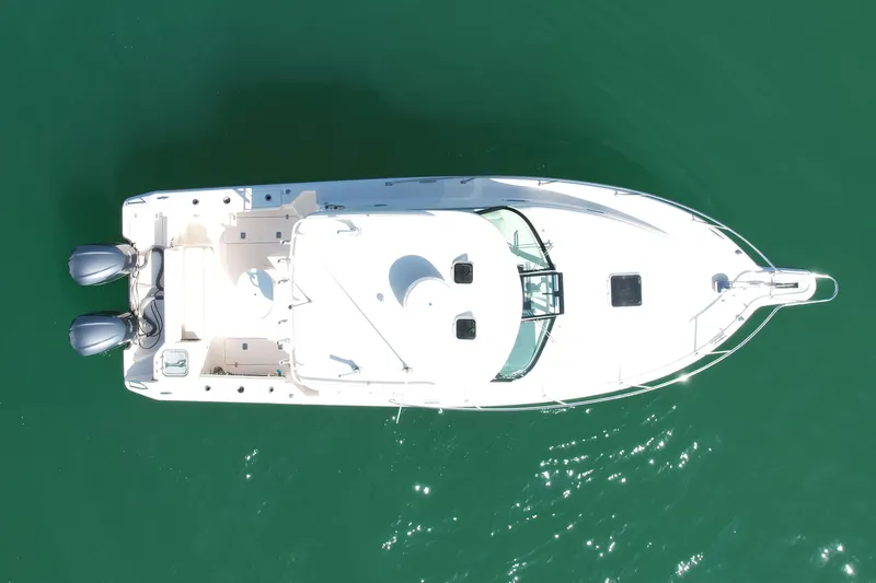 Slide: The Image of Overhead view of 2011 Pursuit 315 Offshore boat on green water. - 6